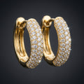 Iced Huggie Hoop Earrings in gold paved with moissanite